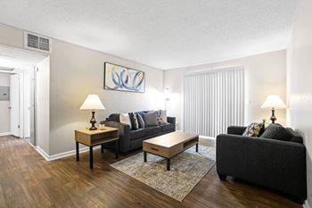 A living room with a couch and a table